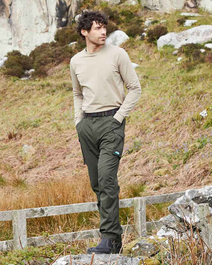 Deep Forest coloured Ridgeline Mens Grafter Trousers on hillside background #colour_deep-forest