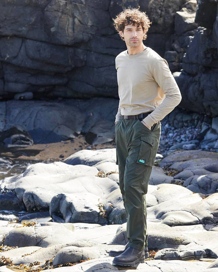 Deep Forest coloured Ridgeline Mens Grafter Trousers on shore background #colour_deep-forest
