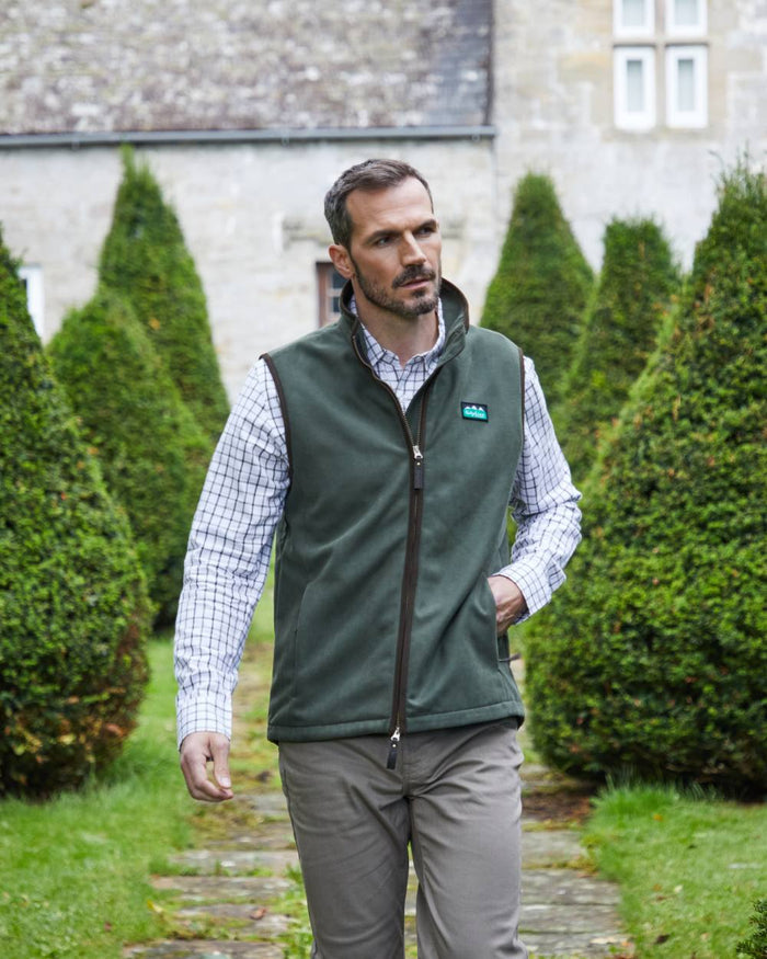 Deep Forest coloured Ridgeline Mens Monarch Gilet on lawn background #colour_deep-forest