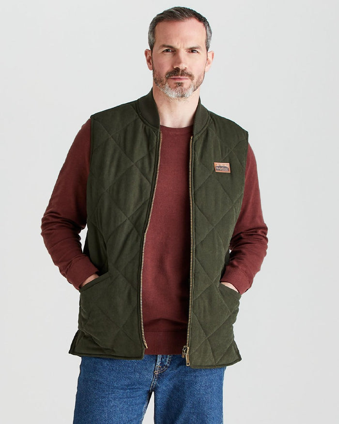 Deep Forest coloured Ridgeline Mens Wester Skeld Gilet on grey background #colour_deep-forest