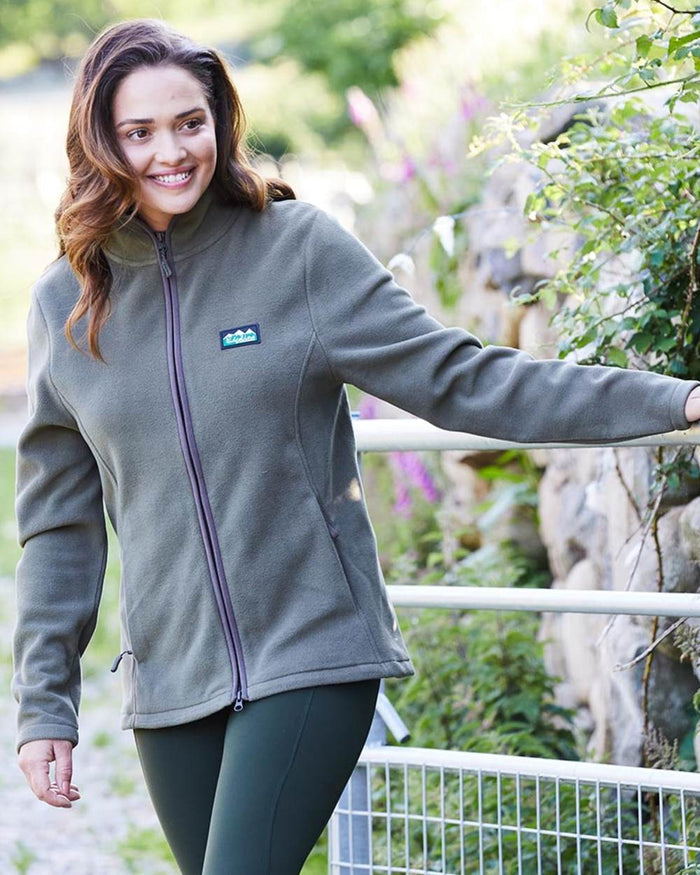 Ivy Green coloured Ridgeline Womens Brenna Fleece Jacket on mountain background #colour_ivy-green