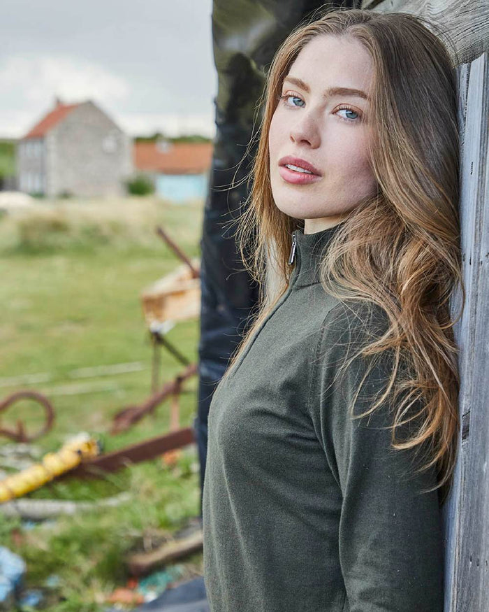 Deep Forest coloured Ridgeline Womens Melford Knit 1/4 Zip Jumper on field background #colour_deep-forest