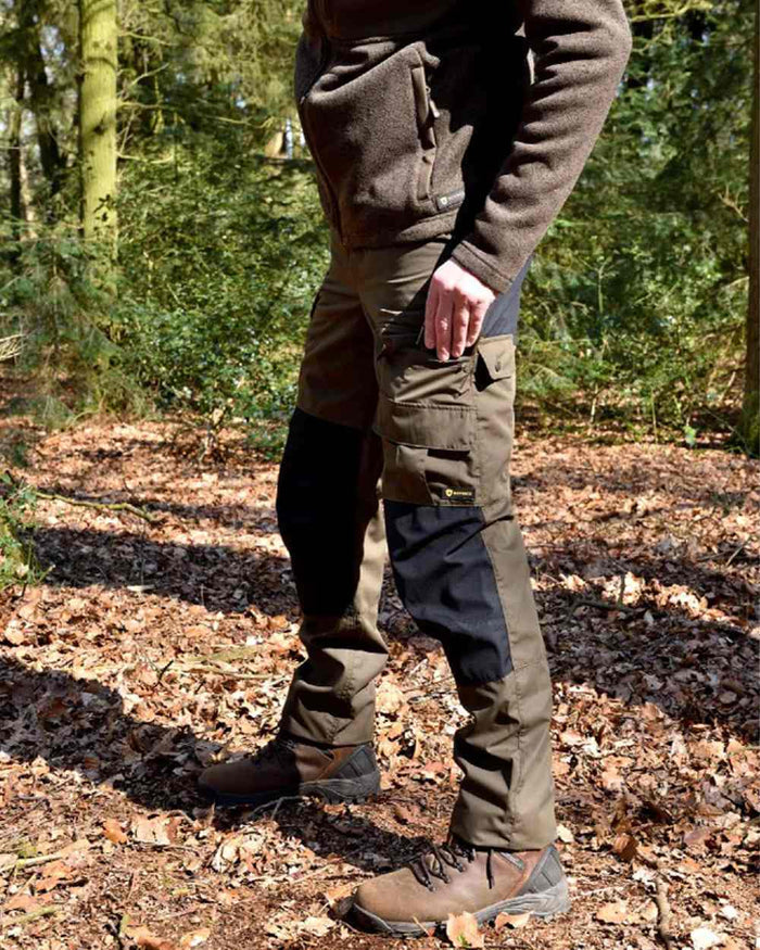 Green/Black coloured Rovince Mens Duofit Trousers on forest background #colour_green-black