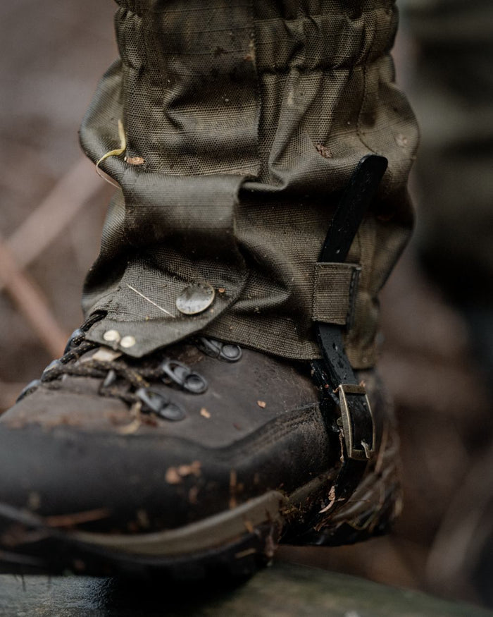 Shaded Olive coloured Seeland Buckthorn Duro Gaiters on forest background #colour_shaded-olive