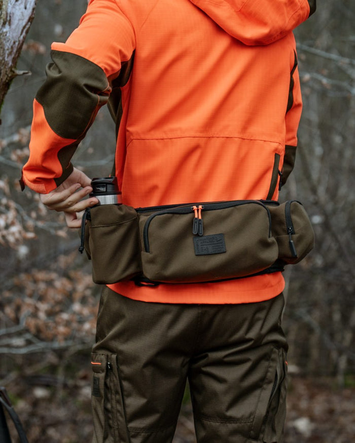 Pine Green coloured Seeland Enduro Utility Waist Pack on forest background #colour_pine-green