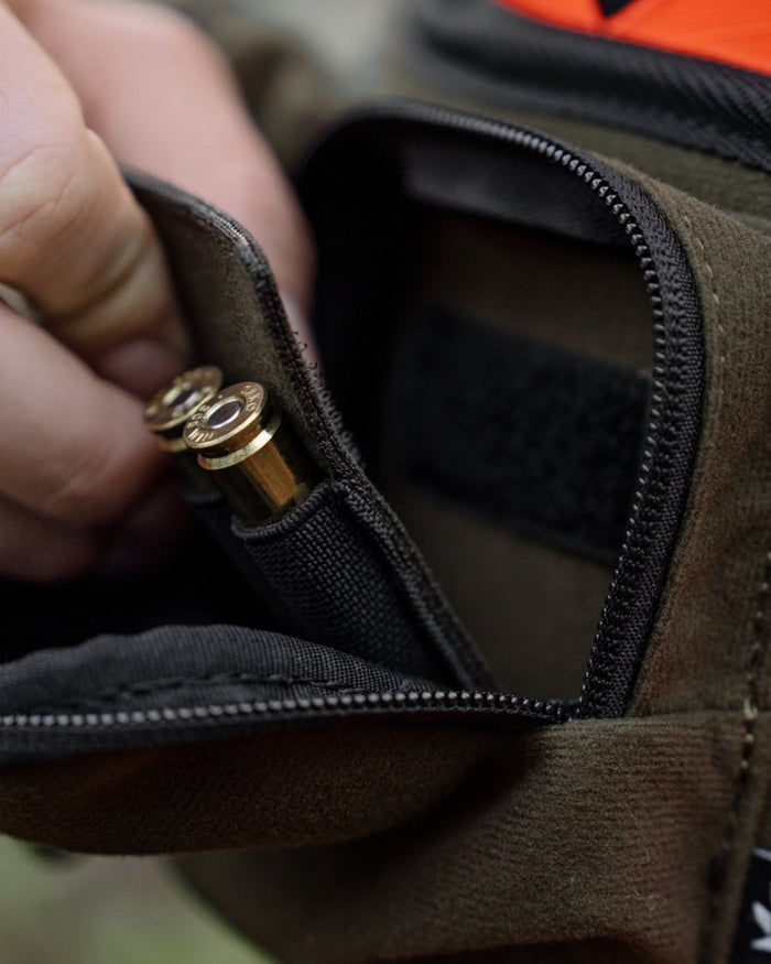 Pine Green coloured Seeland Enduro Utility Waist Pack on forest background #colour_pine-green