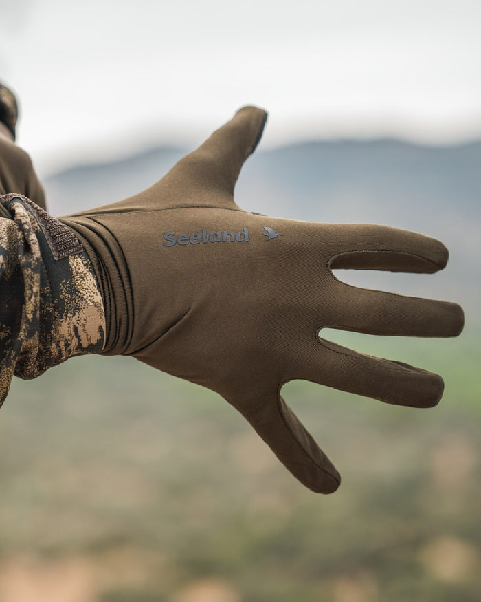 Pine Green Coloured Seeland Grip Gloves on outdoor background #colour_pine-green