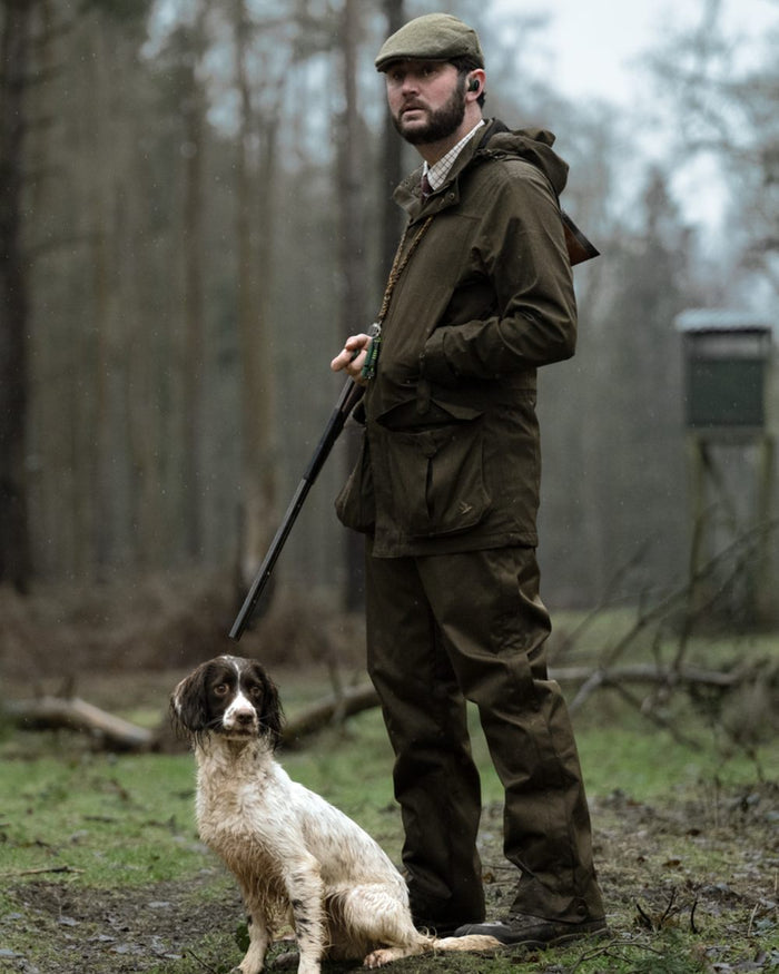 Shaded Olive coloured Seeland Mens Buckthorn Duro Overtrousers on forest background #colour_shaded-olive
