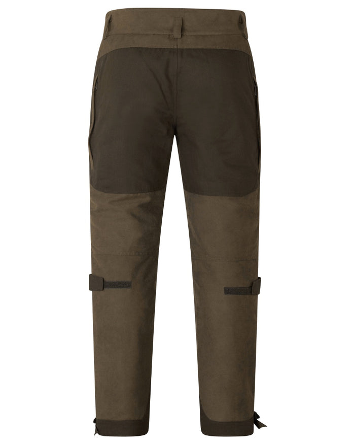 Grizzly Brown coloured Seeland Mens Ultimo Trousers on forest background #colour_grizzly-brown