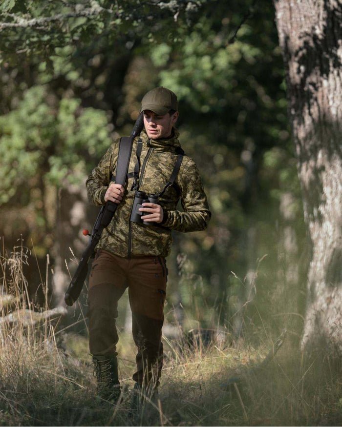 InVis Green Coloured Seeland Power Camo Fleece Jacket on forest background #colour_invis-green