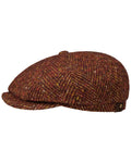 Autumn Red Coloured Stetson Hatteras Herringbone Flat Cap On A White Background #colour_autumn-red