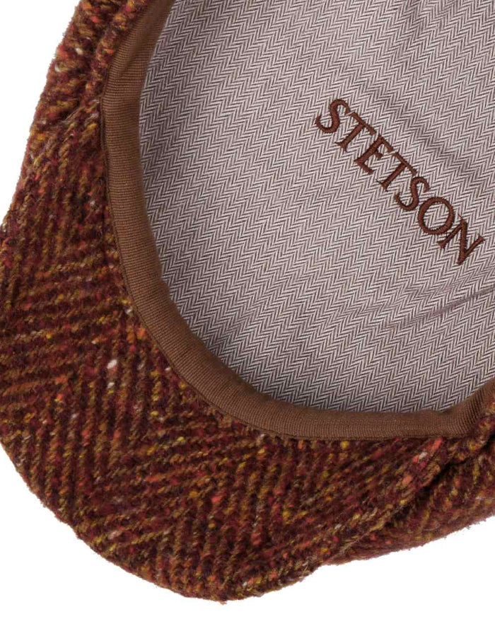 Autumn Red Coloured Stetson Hatteras Herringbone Flat Cap On A White Background #colour_autumn-red