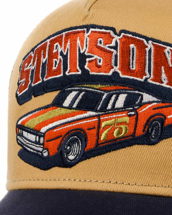Navy Ochre coloured Stetson Muscle Car 75 Trucker Cap on white background #colour_navy-ochre