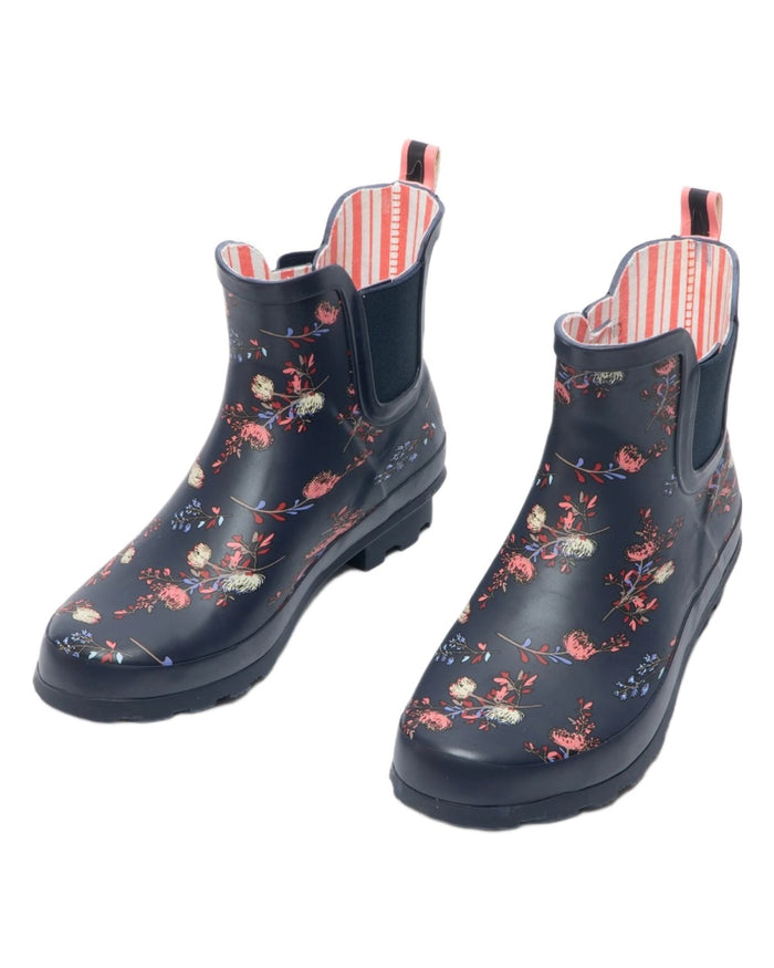Navy Floral Print coloured Stormwells Womens Floral Printed Wellington Boots on white background #colour_navy-floral-print