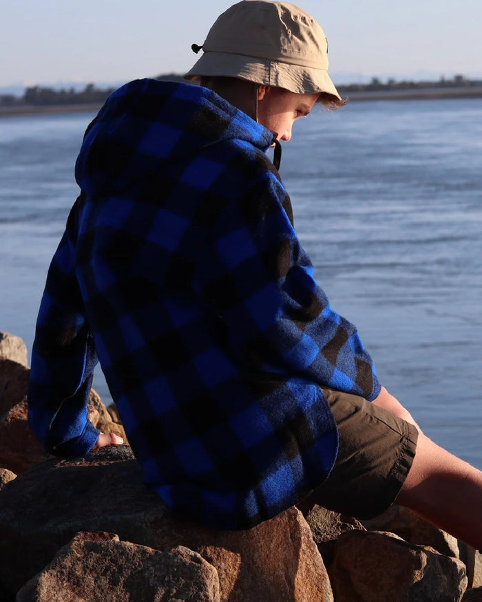 Blue Black Check Coloured Swanndri Kids Brixton Wool Bushshirt on sea background #colour_blue-black-check
