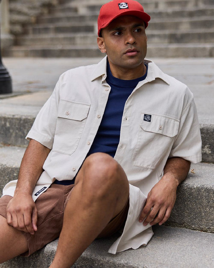 Light Taupe Coloured Swanndri Mens Fundamentals Short Sleeve Work Shirt on stair background #colour_light-taupe