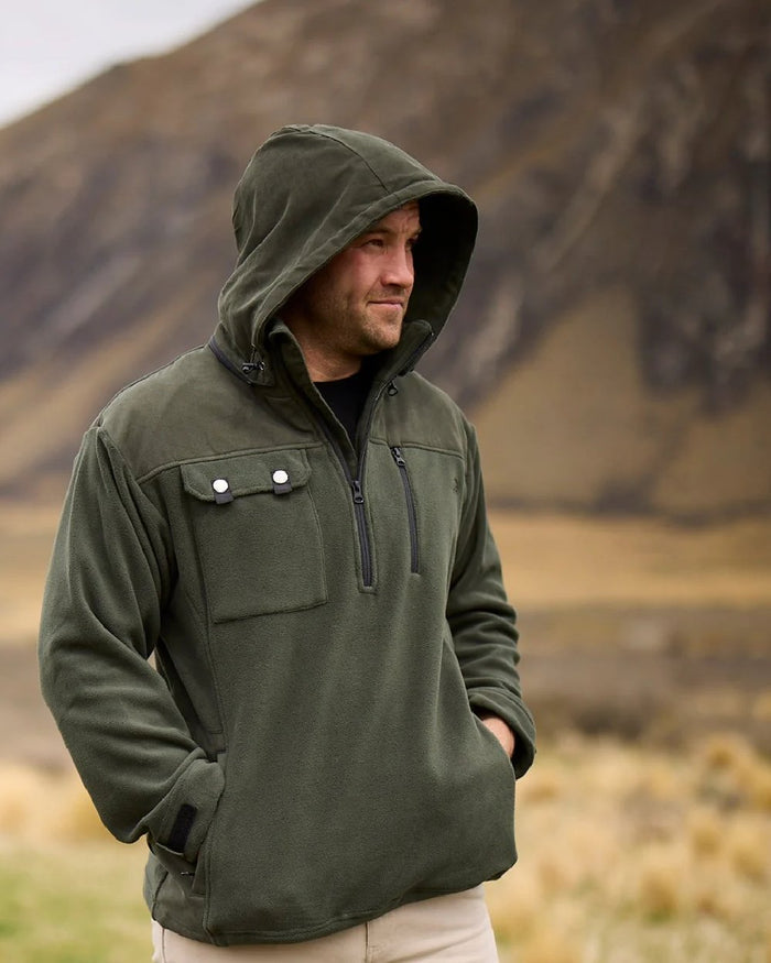 Olive Coloured Swanndri Mens High Rock Technical Fleece Hoodie on mountain background #colour_olive