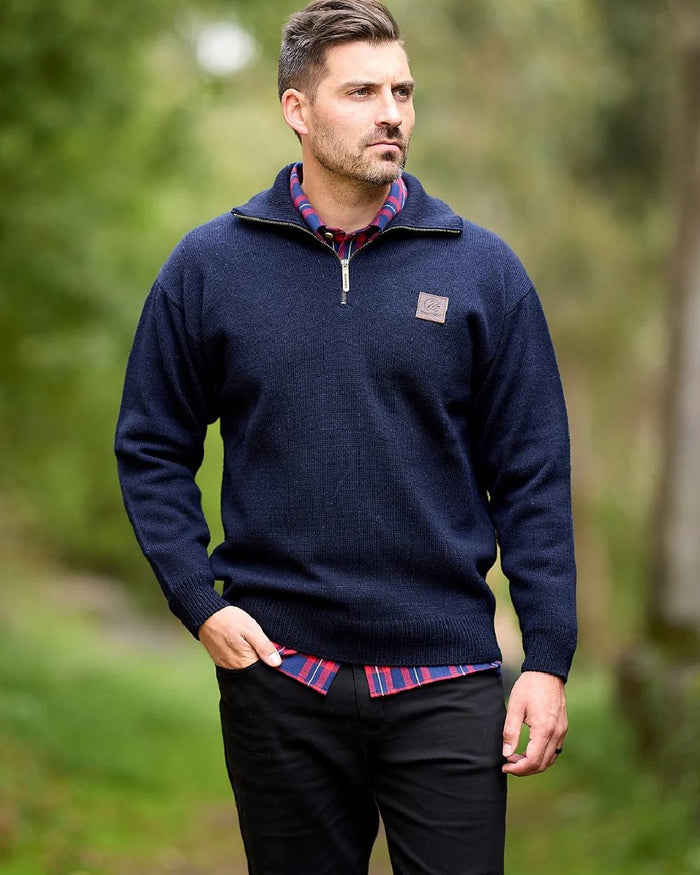 Navy Coloured Swanndri Mens Mariner Wool Zip Neck Sweater on blurry background #colour_navy