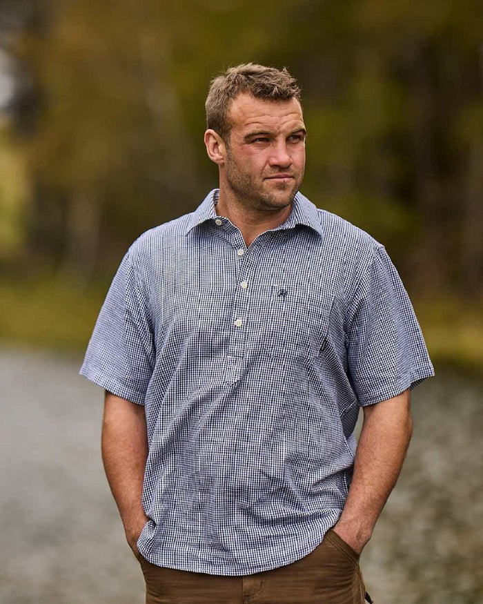 Navy White Check Coloured Swanndri Mens Paihia Short Sleeve Shirt on blurry background #colour_navy-white-check