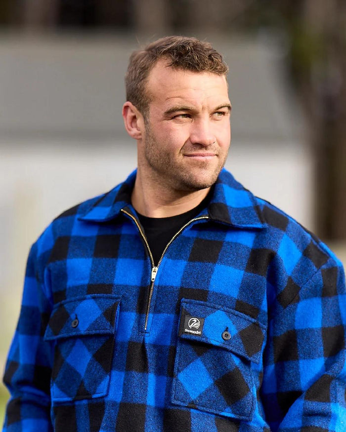 Blue Black Check Coloured Swanndri Mens Ranger Wool Zip Front Bushshirt on blurry background #colour_blue-black-check