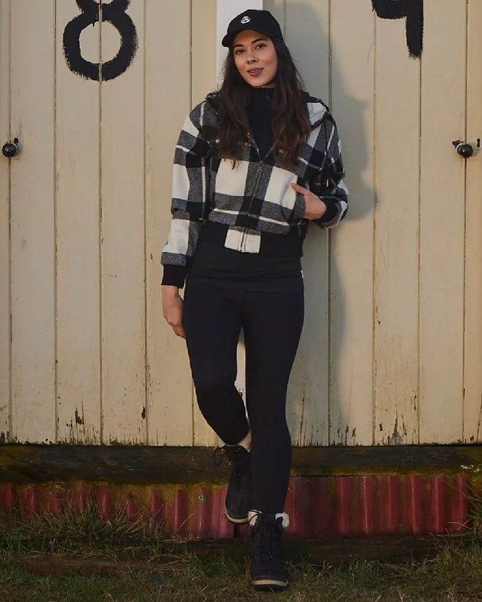 Black Coloured Swanndri Womens Merino Fusion Leggings on outdoor background #colour_black
