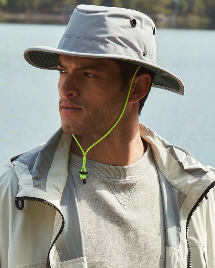 Grey Green coloured Tilley TWS1 All Weather Hat on sea background #colour_grey-green