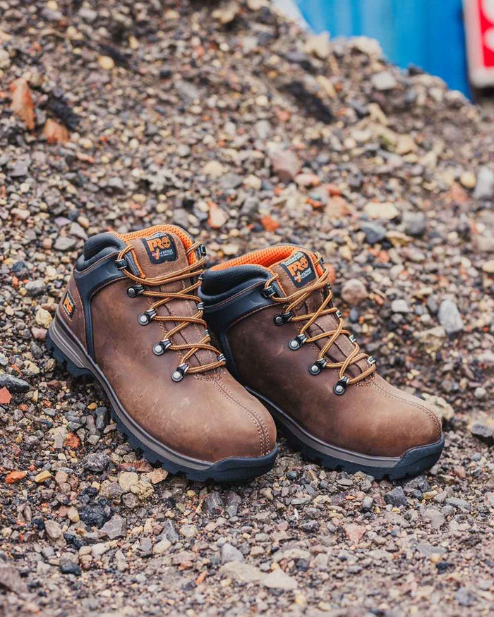 Brown coloured Timberland Pro Splitrock XT Composite Safety Toe Work Boots on construction background #colour_brown
