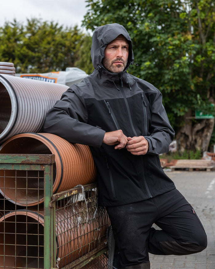Black coloured TuffStuff ProShell Jacket on urban background #colour_black
