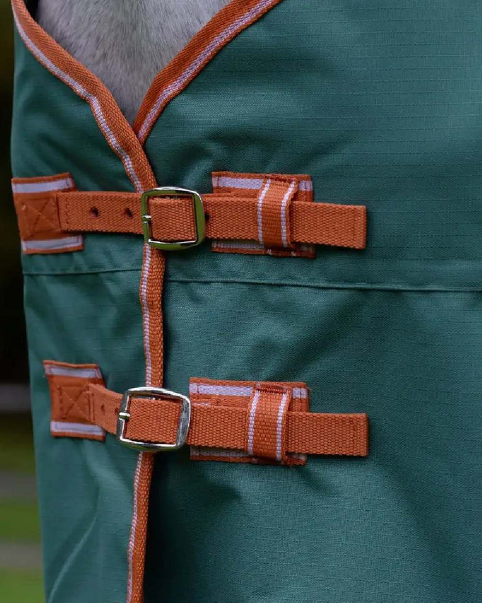 Green Burnt Orange White coloured Weatherbeeta ComFiTec Tyro Standard Neck Medium on blurry background #colour_green-burnt-orange-white