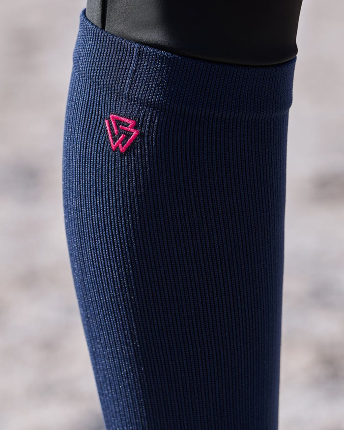 Navy Bright Pink coloured Weatherbeeta Compression Knee Length Riding Socks on outdoor background #colour_navy-bright-pink