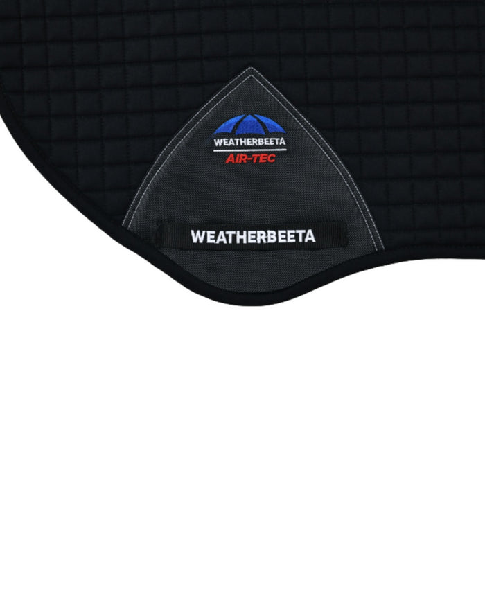 Black Coloured WeatherBeeta Prime Air-Tec Jump Shaped Saddle Pad on white background #colour_black