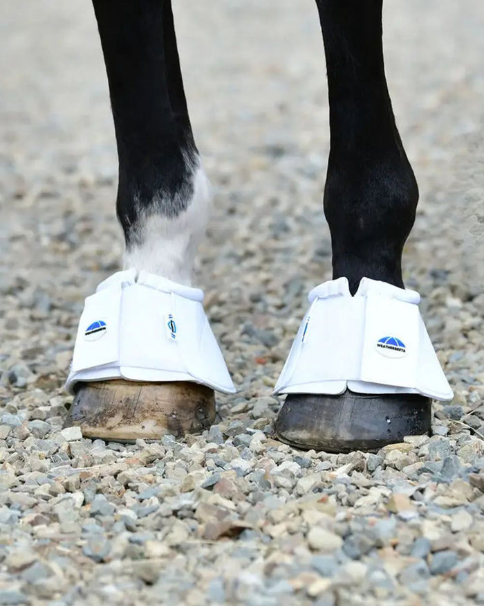 White Coloured WeatherBeeta Tough-Tec Impact Bell Boots on street background #colour_white