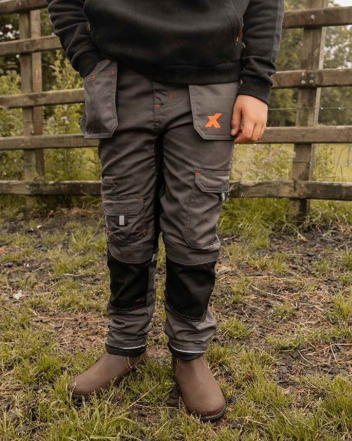 Grey Coloured Xpert Children Pro Stretch Work Trousers on Outdoor Background
#colour_grey