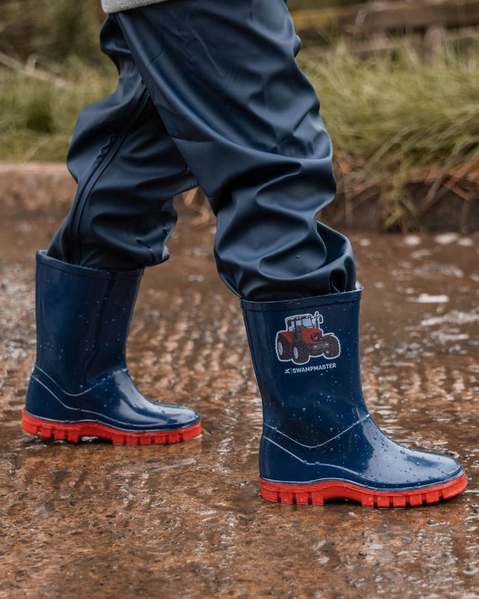 Navy Red Coloured Xpert Childrens Swampmaster Tractor Wellingtons on Outdoor Background
#colour_navy-red