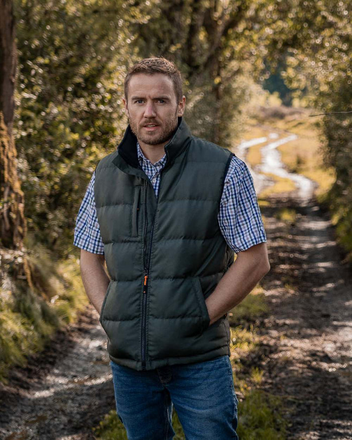 Green Coloured Xpert Mens Core Padded Work Bodywarmer on Forest Background
#colour_green