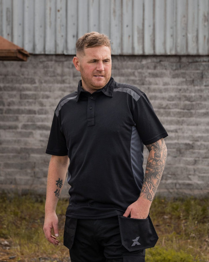 Black Grey Coloured Xpert Mens Pro Stretch Polo Shirt on Outdoor Background
#colour_black-grey