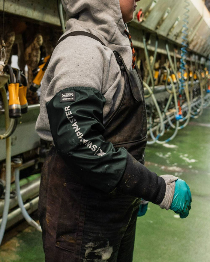 Green Coloured Xpert Swampmaster Stormgear Waterproof Dairy Sleeves on Factory Background
#colour_green