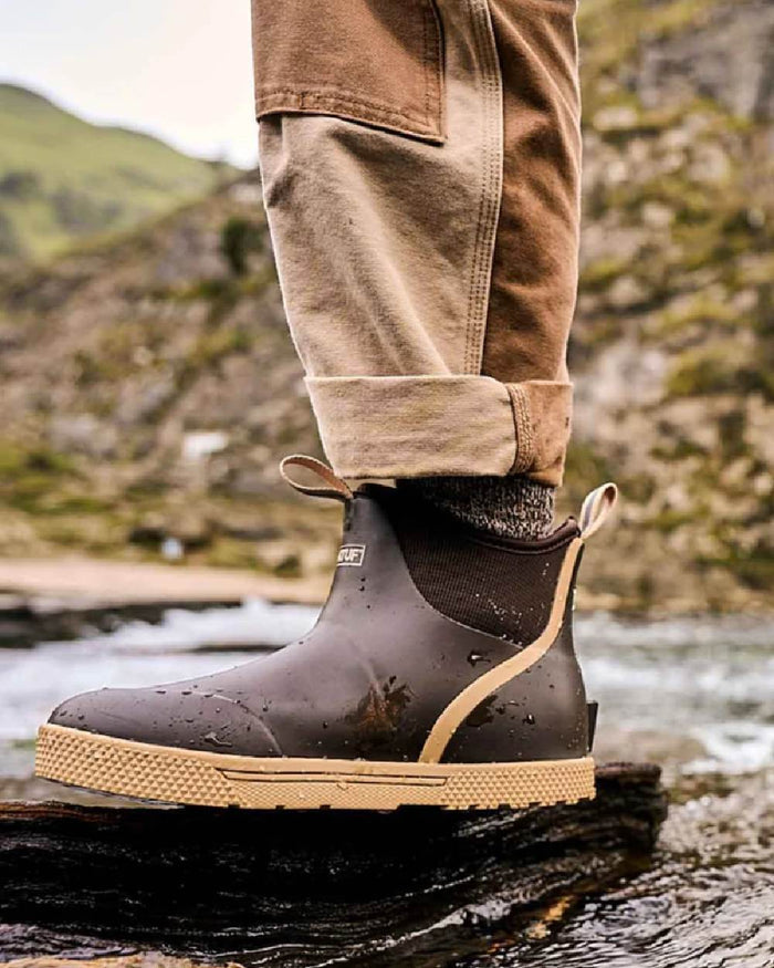 Brown Coloured Xtratuf Mens 6" Wheelhouse Ankle Boat Boots on outdoor background #colour_brown