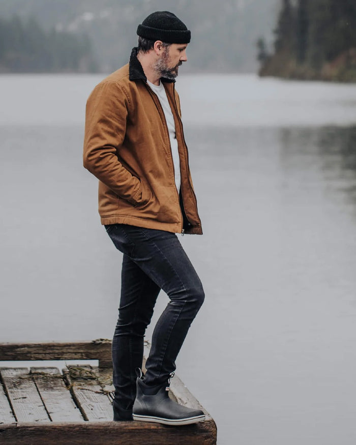 Black Coloured Xtratuf Mens Trolling Pack Fleece Lined Ankle Deck Boots on outdoor background #colour_black
